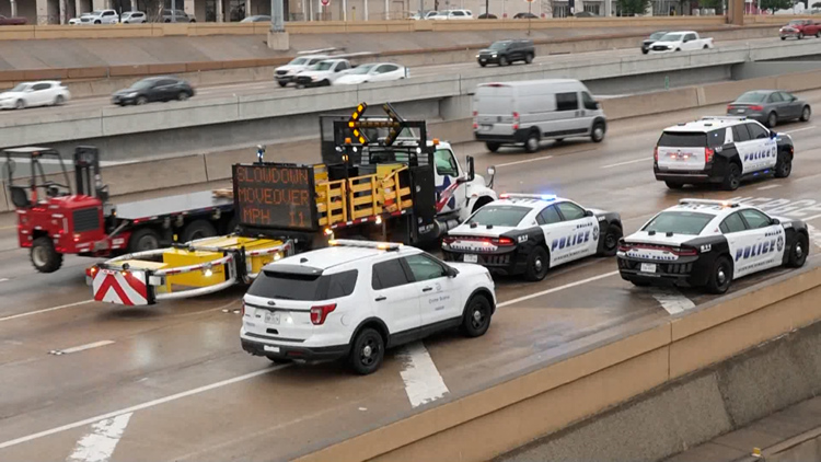 Emergency responders at the scene of a road rage shooting on I-635.